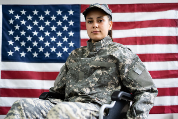 Patriotic Young Veteran Soldier In Wheel Chair